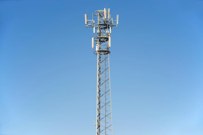 a cell phone tower sitting in the middle of a field, pexels, renaissance, height detailed hd realistic 8 k, square, clear blue sky, mega structure