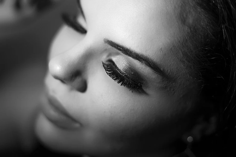 a black and white photo of a woman's eyes, a black and white photo, pexels contest winner, romanticism, evening makeup, elegant profile posing, lashes, eye shadow