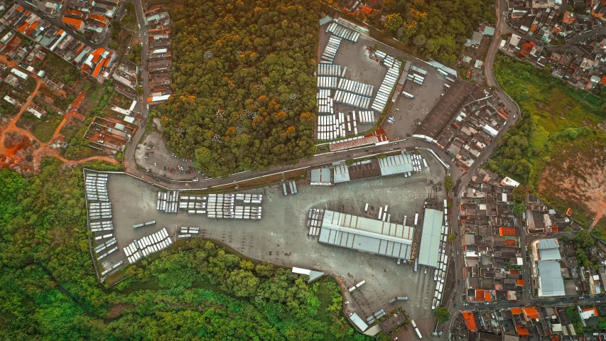 an aerial view of a city with lots of buildings, unsplash, photorealism, woodland, trading depots, marsden, stacked image