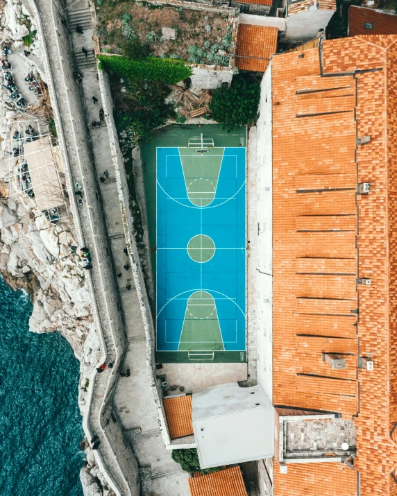 an aerial view of a basketball court in croatia, pexels contest winner, snapchat photo, square, dubrovnik, still from a wes anderson movie