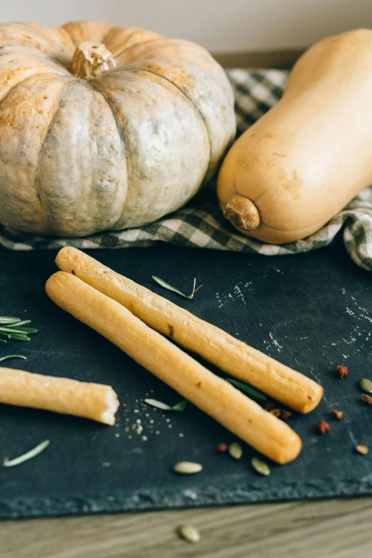 a table topped with different types of food, by Matthias Stom, unsplash, renaissance, baking french baguette, pumpkins, square, black chalk