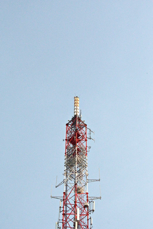 a red and white tower with a blue sky in the background, flickr, dada, antennas, 2 5 6 x 2 5 6 pixels, construction, brown