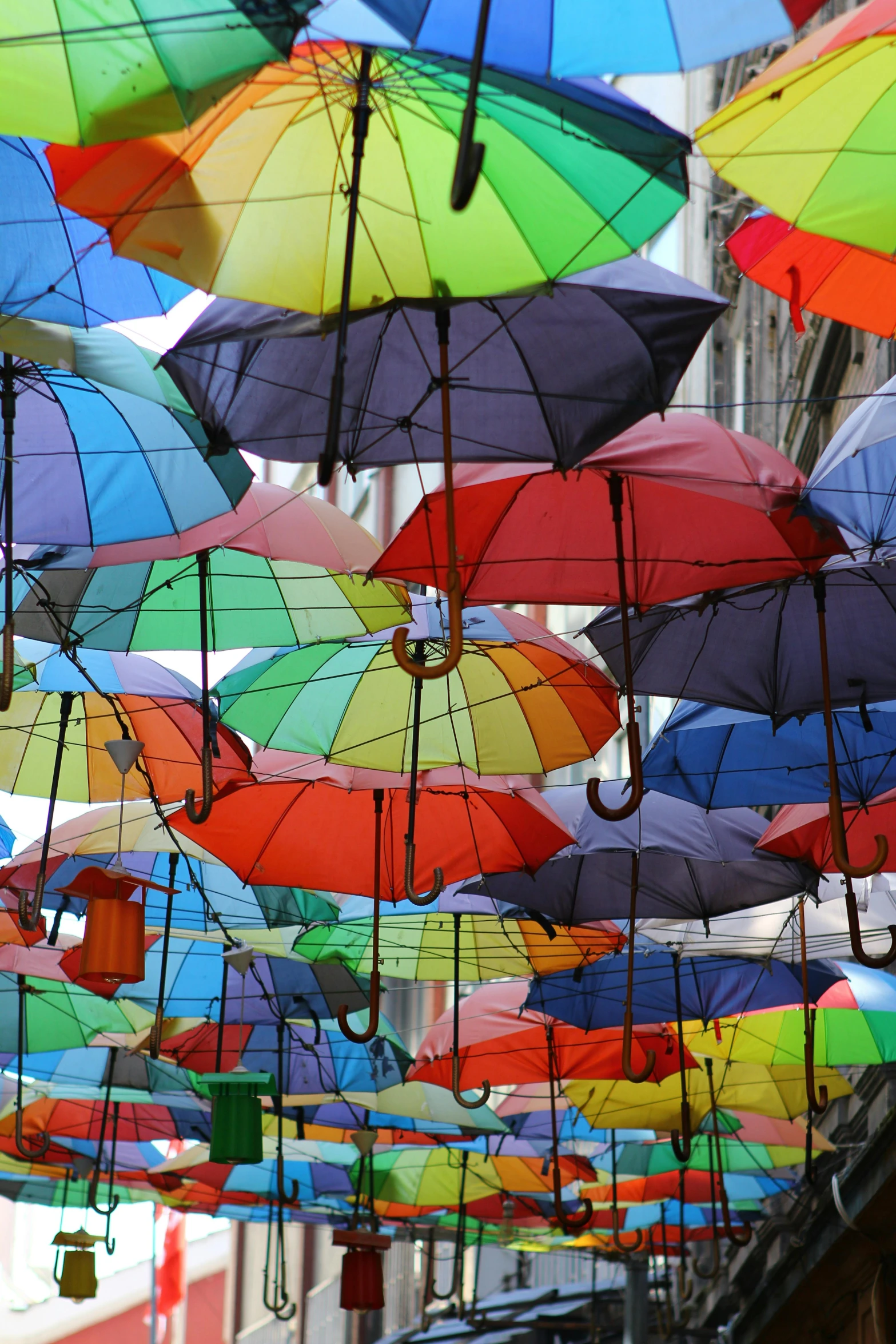 a street filled with lots of colorful umbrellas, 2 5 6 x 2 5 6 pixels, up close, multiple stories, spanish