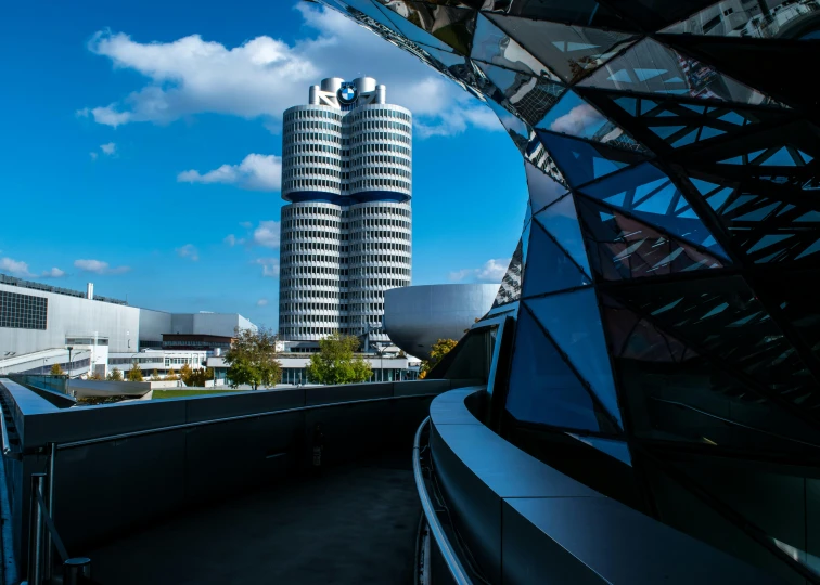 a very tall building sitting in the middle of a city, unsplash contest winner, bauhaus, bmw, two organic looking towers, 15081959 21121991 01012000 4k, hyper photo realistic 8k hd hdri