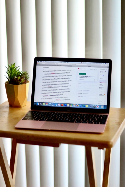 a laptop computer sitting on top of a wooden table, by Carey Morris, unsplash, multiple stories, scientific paper, at home, official screenshot