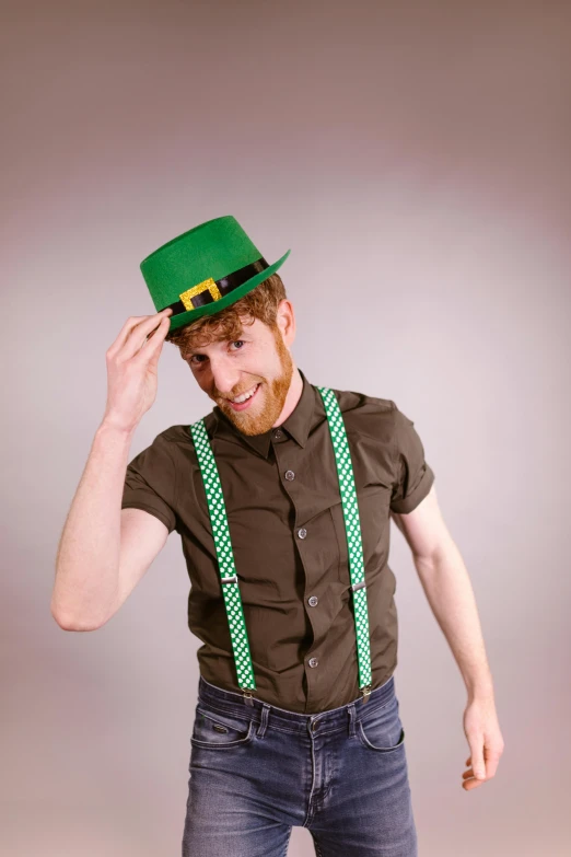 a man wearing a green hat and suspends, a colorized photo, inspired by Mór Than, reddit, happening, hr ginger, hands on hips, plain background, square