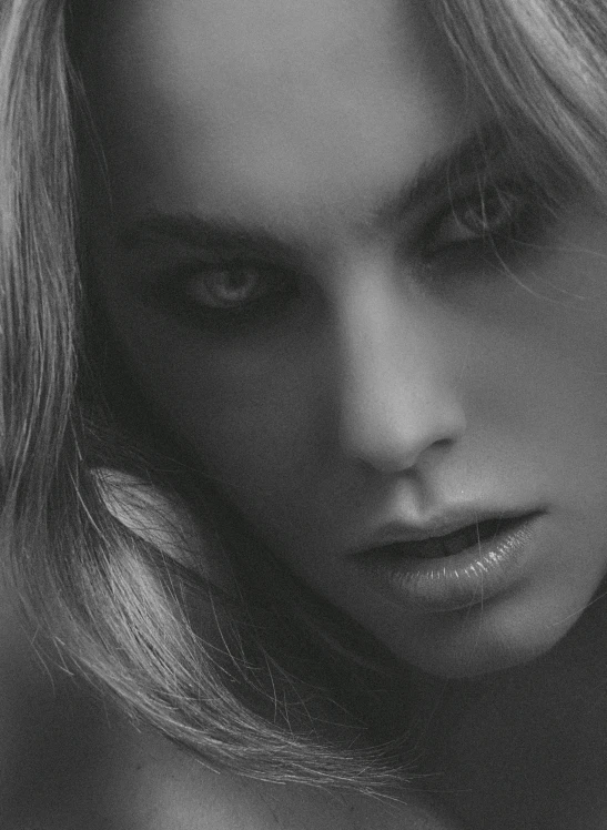 a black and white photo of a woman with long hair, trending on cgsociety, pretty margot robbie vampire, zoomed in, album cover, eyes!