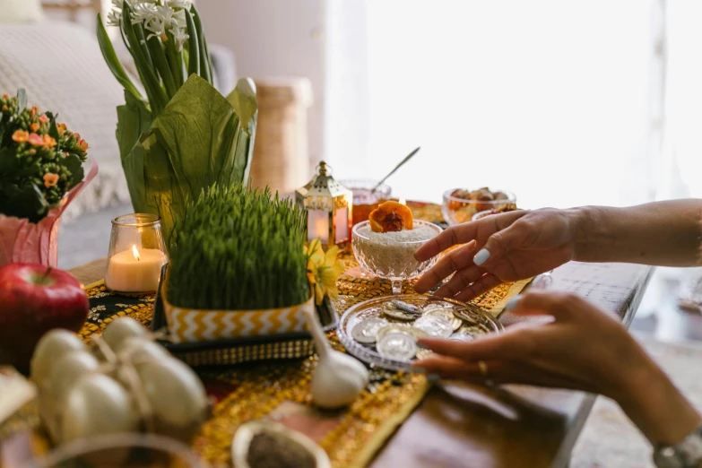 a couple of people that are sitting at a table, by Julia Pishtar, trending on unsplash, renaissance, sukkot, ingredients on the table, in style of thawan duchanee, detail shot