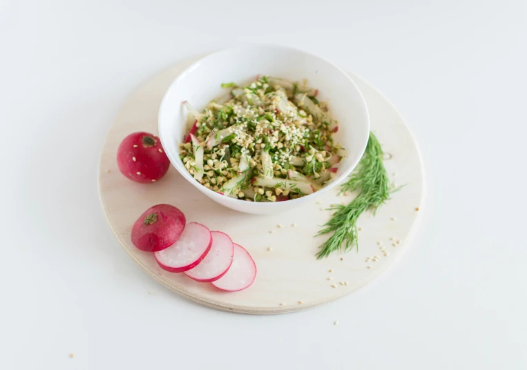 a white plate topped with a bowl of food next to radishes, unsplash, hurufiyya, high grain, pine, salad, product view