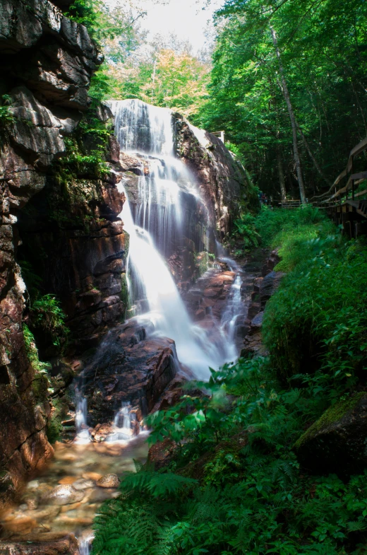 a waterfall in the middle of a lush green forest, new hampshire mountain, slide show, multiple stories, perfect photo