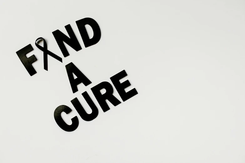 a black and white photo of a sign that says find a cure, pixabay, plain background, background image, a high angle shot, tape