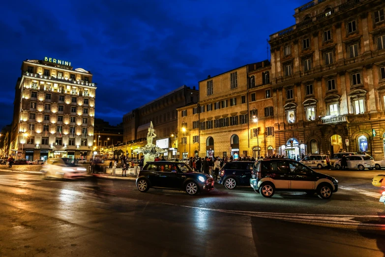 a city street filled with lots of traffic at night, a photo, by Giuseppe Avanzi, pexels contest winner, renaissance, square, nice afternoon lighting, profile image, on a great neoclassical square