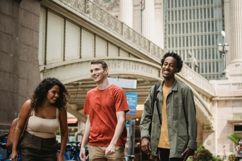 a group of people walking down a city street, a photo, avatar image, chicago, background image, college students