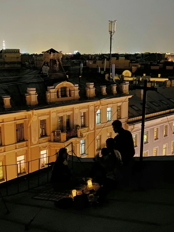 a group of people sitting on top of a roof, during the night, russian architecture, profile image, apartment