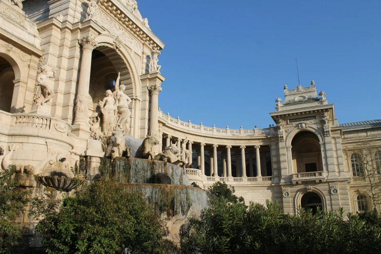 a large building with a fountain in front of it, a statue, by Vincenzo Cabianca, pexels contest winner, art nouveau, promo image, square, giant majestic archways, beige