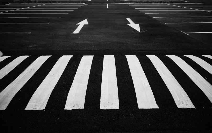 a black and white photo of an empty parking lot, by Giorgio Cavallon, pexels contest winner, white stripes all over its body, with two arrows, 15081959 21121991 01012000 4k, black and white painting