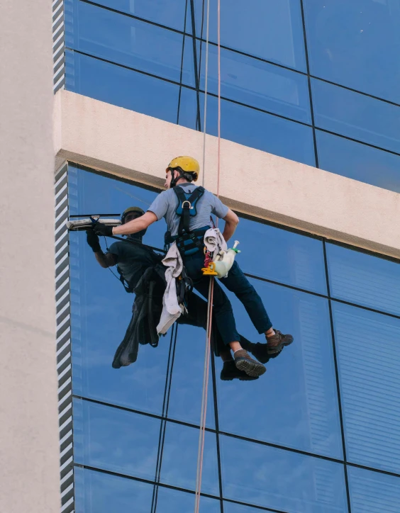 a man hanging from the side of a tall building, 🚀🌈🤩, maintenance photo, thumbnail, full body hero