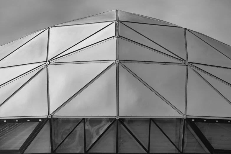 a black and white photo of the roof of a building, inspired by Buckminster Fuller, unsplash contest winner, football, painted metal and glass, profile image, blimps