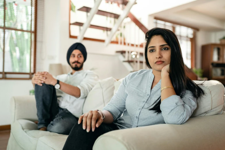 a man and a woman sitting on a couch, indian girl with brown skin, annoyed, mental health, walking to the right