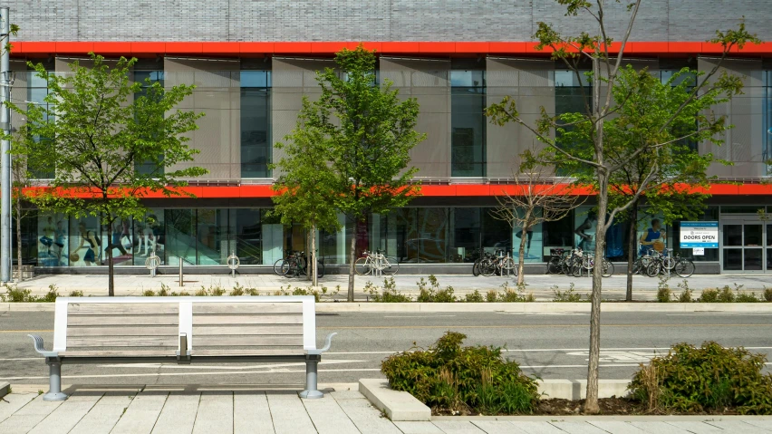 a white bench sitting on the side of a road, a digital rendering, vancouver school, red building, southdale center, “ iron bark, award - winning details