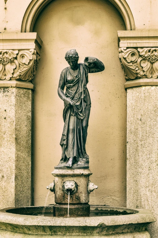 a fountain with a statue on top of it, a statue, inspired by Giovanni Battista Innocenzo Colombo, pexels contest winner, neoclassicism, made of bronze, confident stance, complex and desaturated, brass semi - mechanical woman