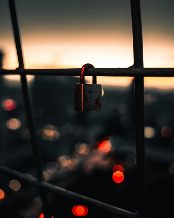 a close up of a lock on a fence, an album cover, inspired by Elsa Bleda, pexels contest winner, happening, night light, city view, lgbtq, today\'s featured photograph 4k