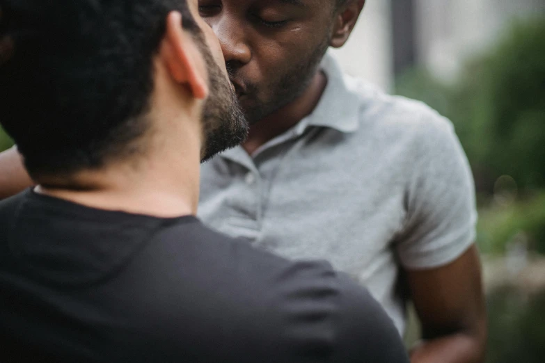 a couple of men standing next to each other, pexels contest winner, making out, varying ethnicities, middle close up shot, high quality product image”