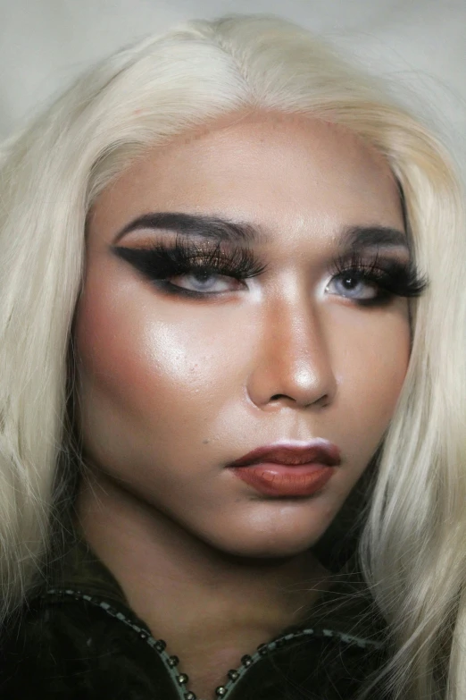 a close up of a person with blonde hair, inspired by Sasha Putrya, heavy makeup, fully frontal view, malaysian, xqc