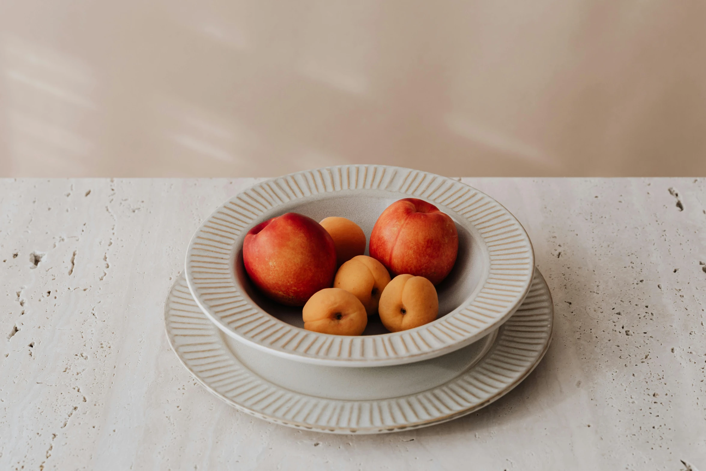 a close up of a bowl of fruit on a table, inspired by Richmond Barthé, featured on pinterest, baroque, a pair of ribbed, beige, high quality product photo, soft rim light