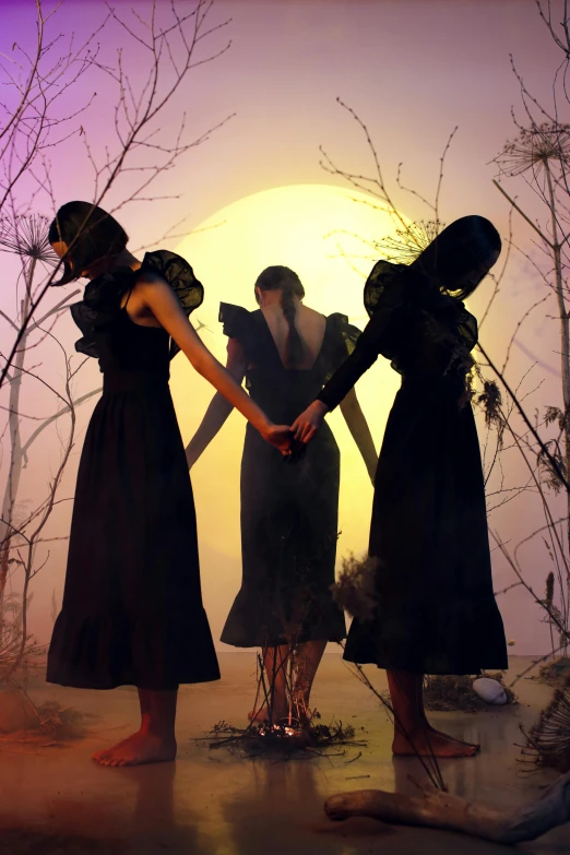 three women holding hands in front of a full moon, an album cover, inspired by Brooke Shaden, trending on pexels, romanticism, serge lutens, witchcore clothes, evening sun, nick knight