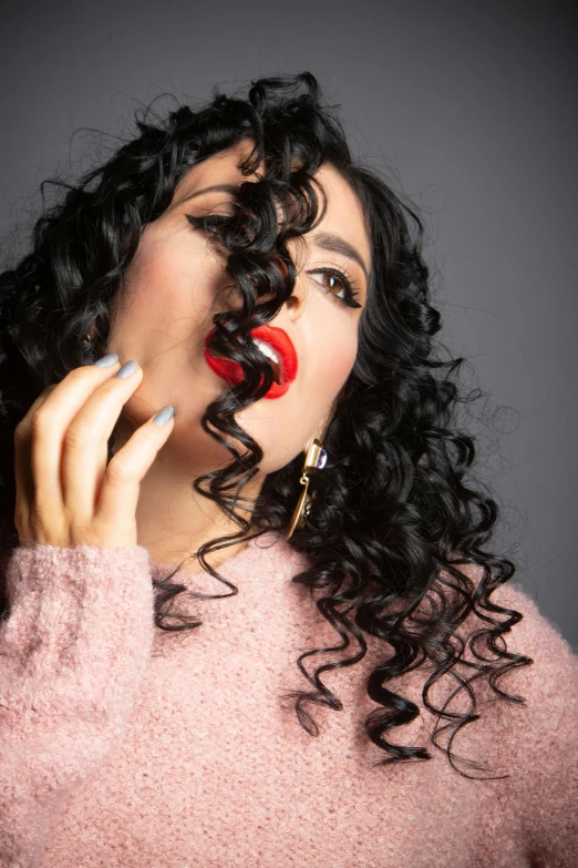 a woman with curly hair talking on a cell phone, an album cover, inspired by Gina Pellón, trending on pexels, happening, lips, betty la fea, studio shoot, curves