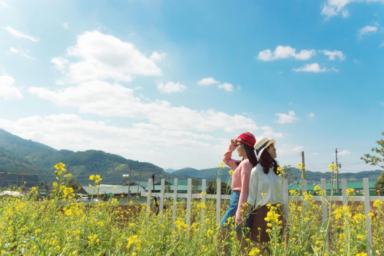 a couple of women standing on top of a lush green field, by Yasushi Sugiyama, happening, sunny sky, south korea, cottagecore, yellow