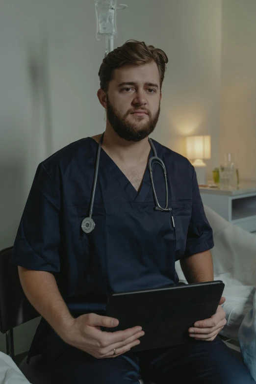 a man with a stethoscope sitting in a hospital bed, a colorized photo, trending on reddit, with a laptop on his lap, lachlan bailey, confident looking, dark. no text