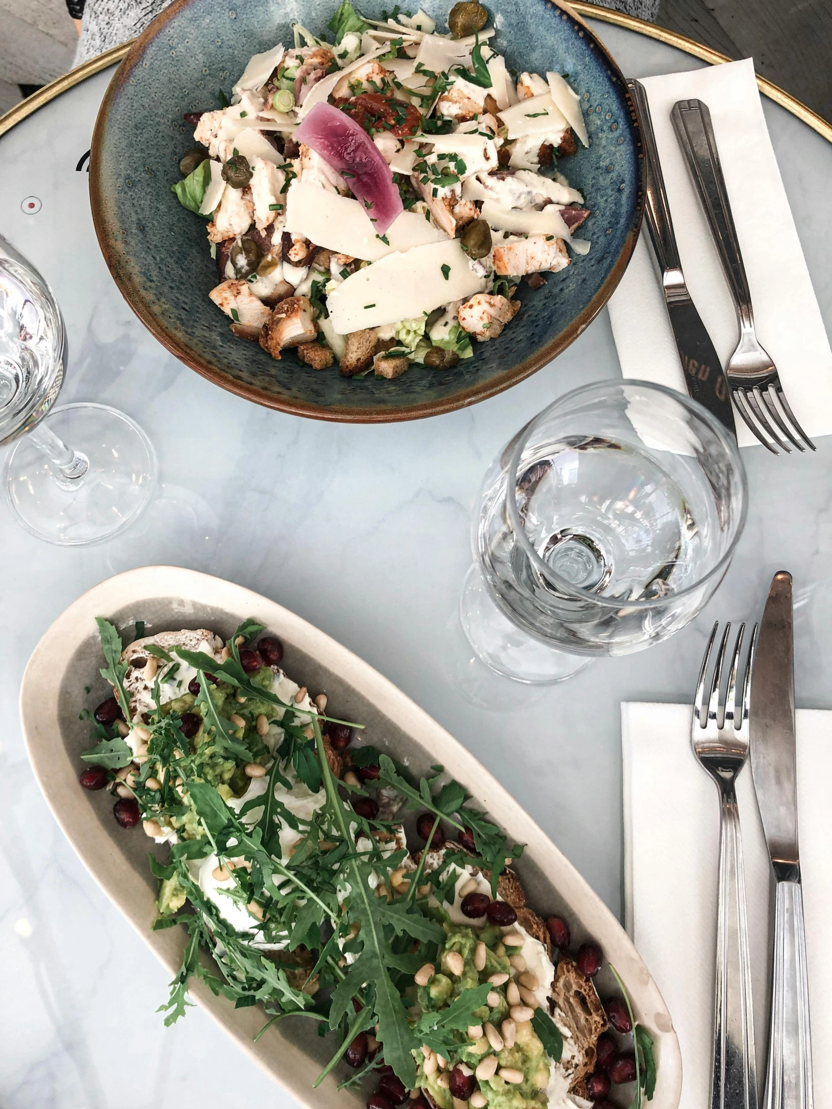 a table topped with plates of food and silverware, profile image, bowl filled with food, thumbnail, salad