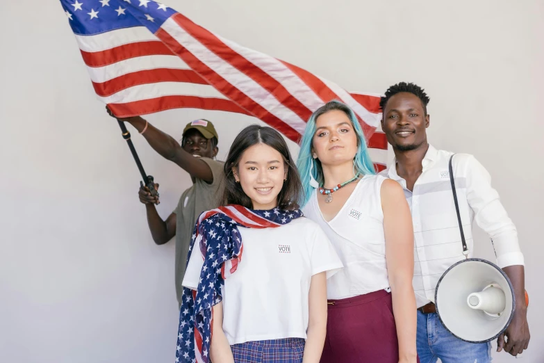a group of people holding an american flag, diverse outfits, portrait featured on unsplash, avatar image, pokimane