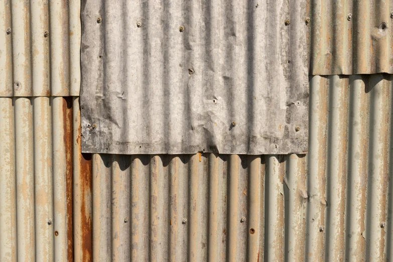 a red fire hydrant sitting in front of a metal wall, an album cover, inspired by Christo, renaissance, roofing tiles texture, gray, rusty, folded