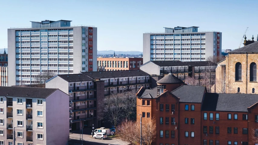 a bunch of buildings that are next to each other, inspired by Thomas Struth, unsplash, brutalism, paisley, wide high angle view, full daylight, distant - mid - shot