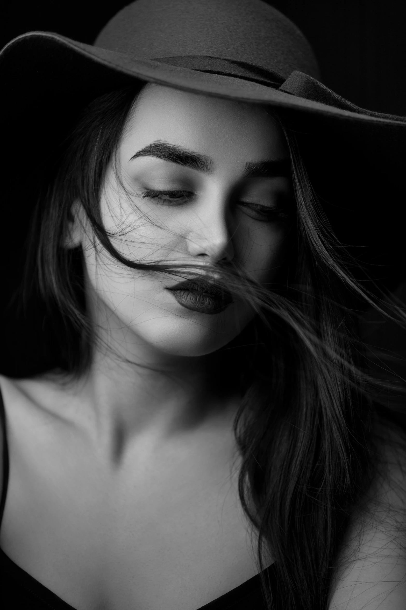 a black and white photo of a woman wearing a hat, a black and white photo, inspired by irakli nadar, pexels contest winner, art photography, sexy lips :5 stylish, deviantart artstation cgscosiety, lilly collins, with closed eyes