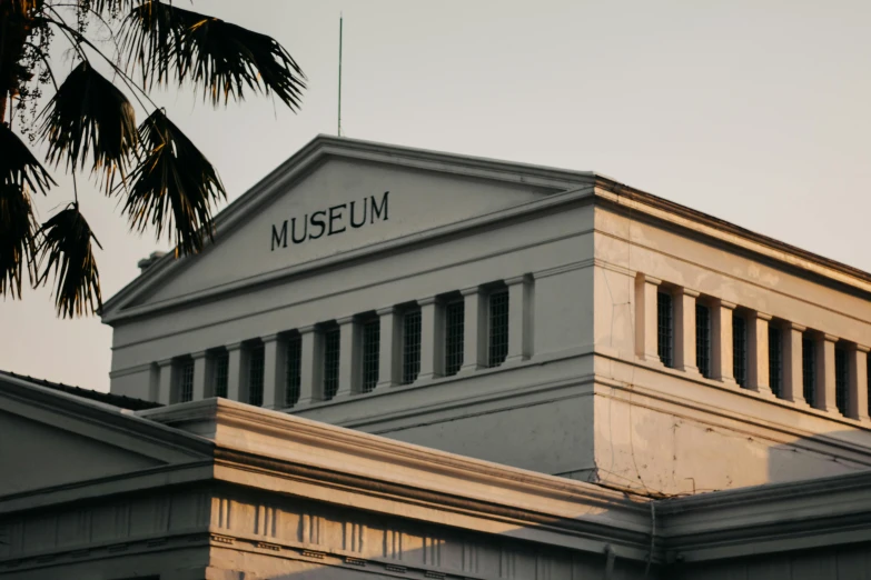 a large building with a clock on top of it, pexels contest winner, bengal school of art, helio oiticica, profile image, manila, at the museum