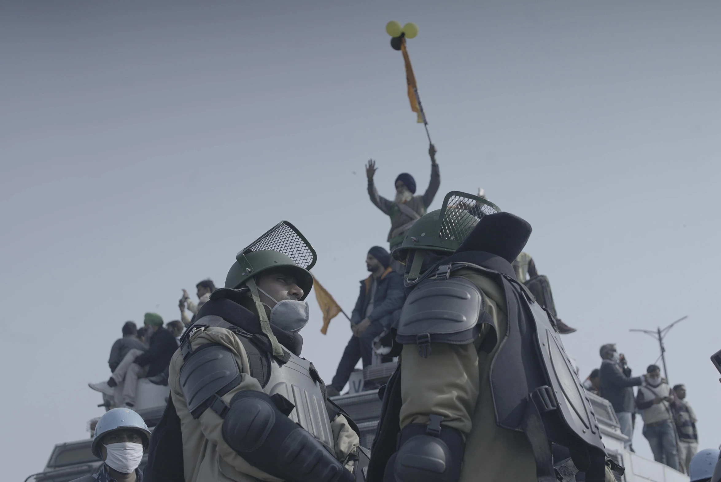 a group of people standing on top of a boat, person wearing gas mask, riot, national geographic channel, ukrainian