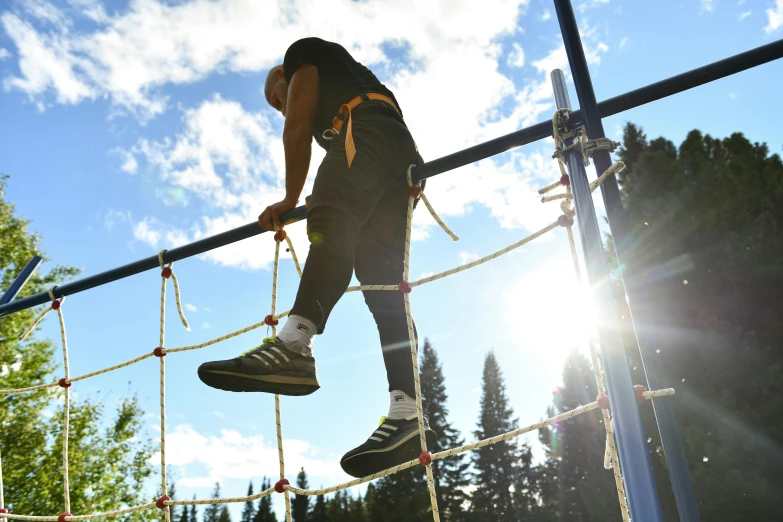 a man that is standing on a rope, adventure playground, tjalf sparnaay 8 k, profile image, 1 2 9 7