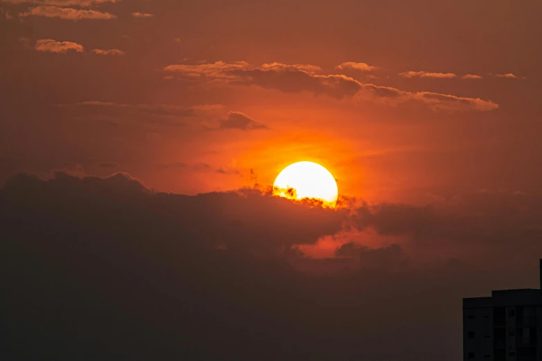 the sun is setting behind the clouds in the sky, pexels contest winner, romanticism, digital yellow red sun, shot on 1 5 0 mm, 33mm photo