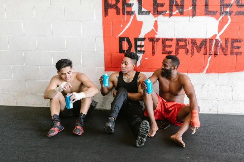 a group of men sitting next to each other, by Robbie Trevino, working out, hydration, profile image, unbothered