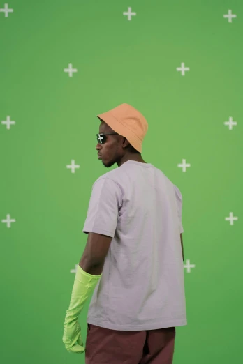 a man standing in front of a green screen, trending on pexels, visual art, playboi carti, with hat, lots of light, luts