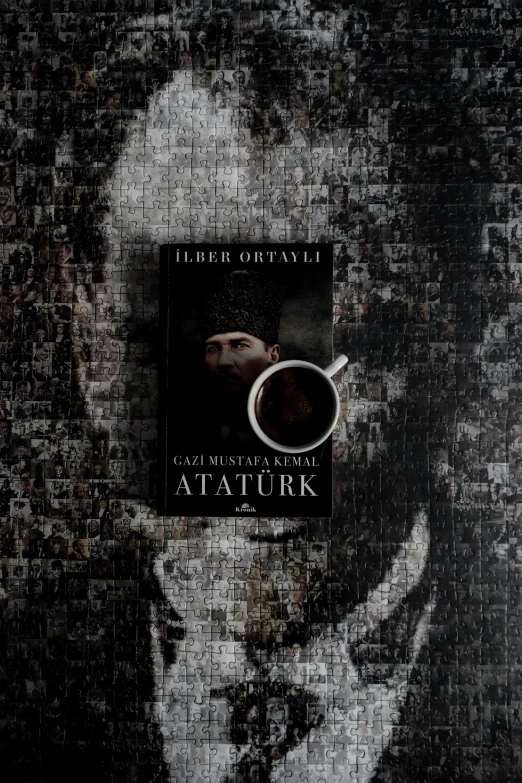 a book sitting on top of a table next to a cup of coffee, an album cover, inspired by Artur Tarnowski, hurufiyya, quak, stalker, turkey, profile picture 1024px