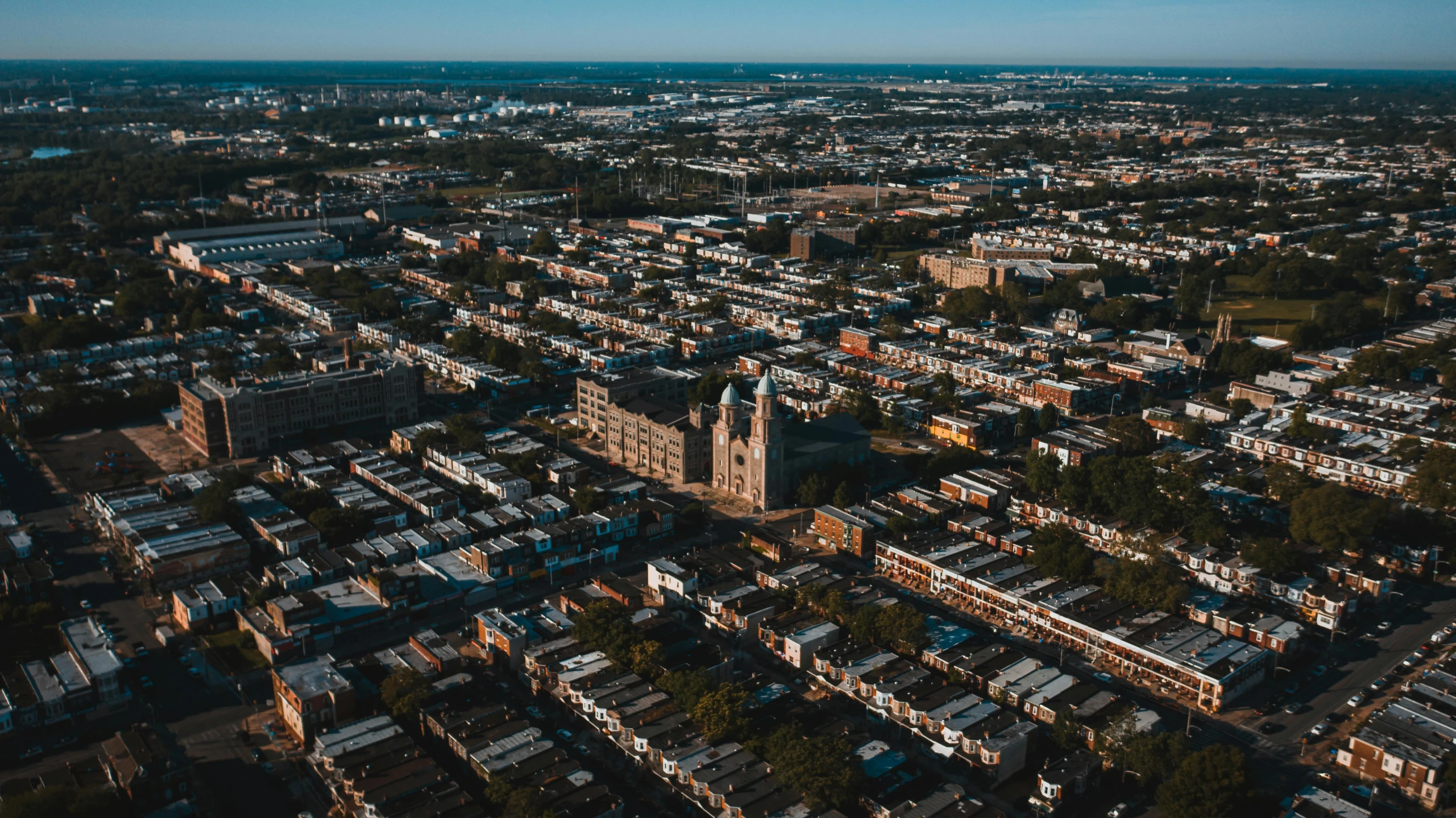 an aerial view of a city with lots of buildings, by Carey Morris, pexels contest winner, new jersey, photographic isometric cathedral, seen from far away, schomburg