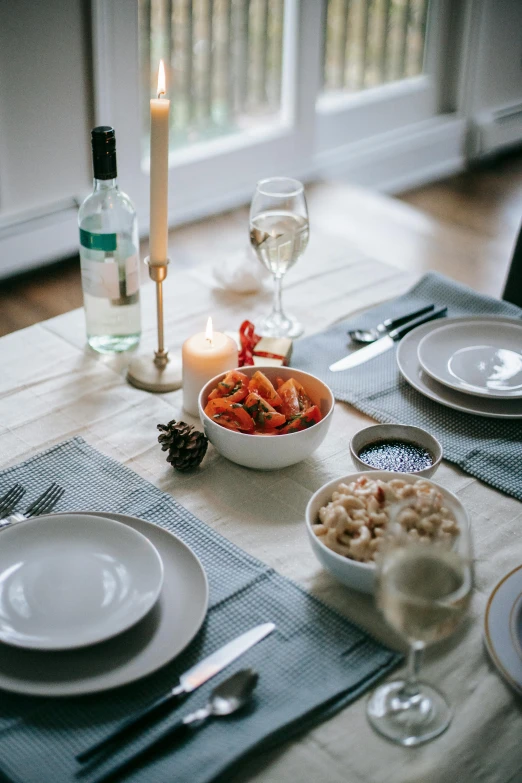 a table that has a bowl of food on it, by Carey Morris, pexels contest winner, renaissance, holiday, clean and simple design, square, crab
