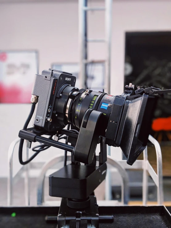 a close up of a camera on a tripod, looking towards the camera, motion capture system, shot with sony alpha 1 camera, large format camera