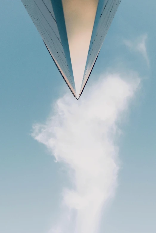 a large jetliner flying through a blue sky, by Ryan Pancoast, unsplash contest winner, conceptual art, tear drop, plume made of geometry, launch of a rocket, close-up from above