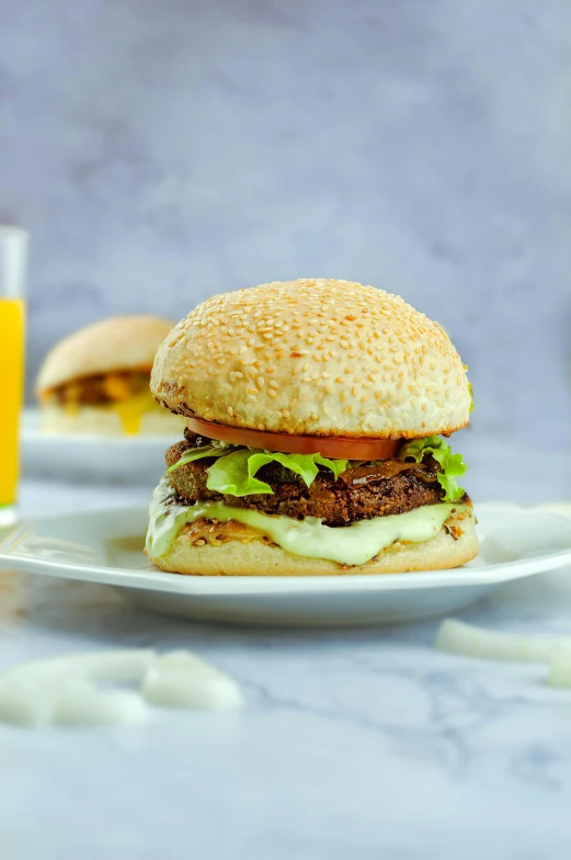 a hamburger sitting on top of a white plate next to a glass of orange juice, square, 4l, moroccan, game ready